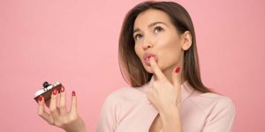 Woman thinking about eating brownie