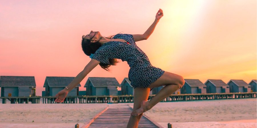 woman dancing on a dock